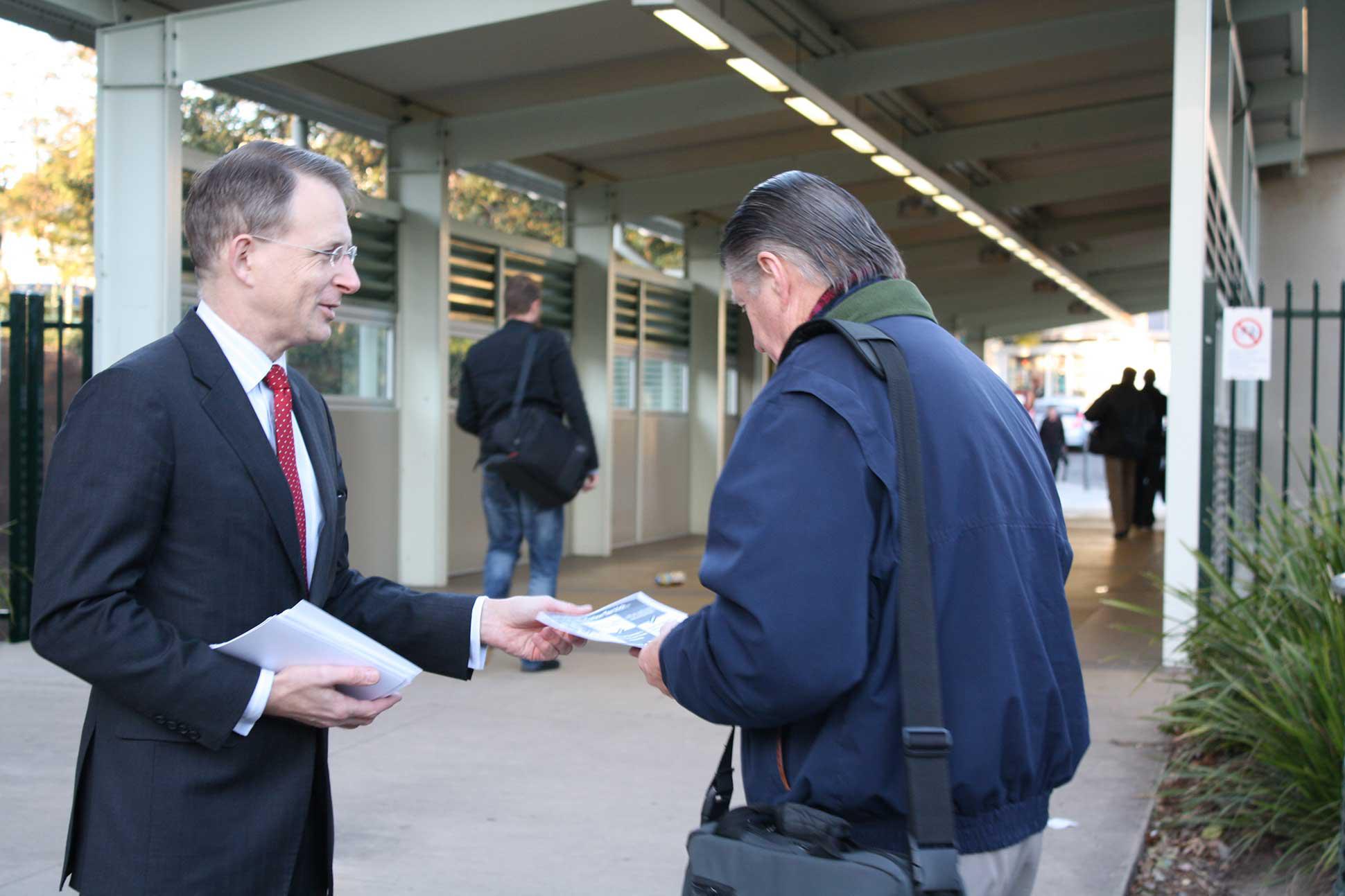 Photo of Paul campaigning at a local train station